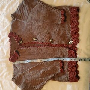 Hand knitted sweater.